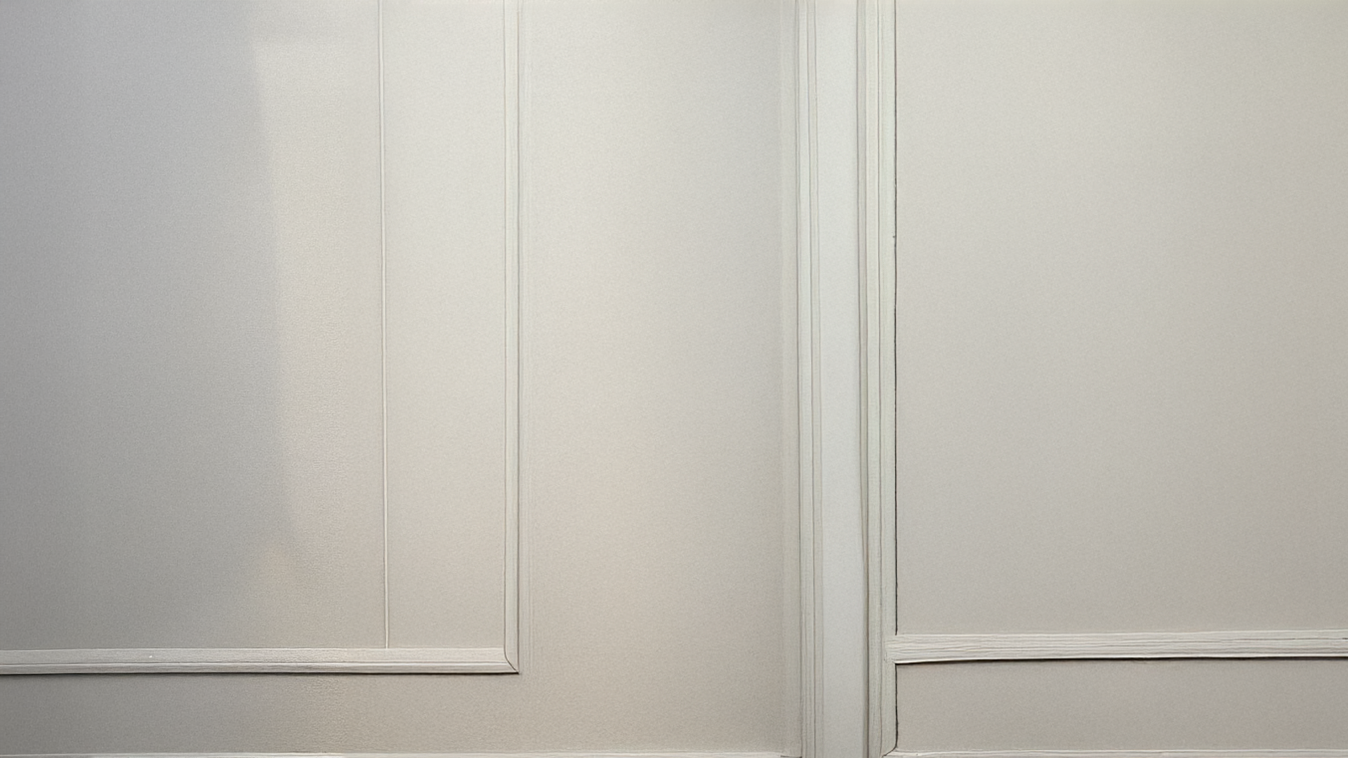 A quiet, empty wall that holds space for whatever's coming next. Calm. Neutral. Full of possibility